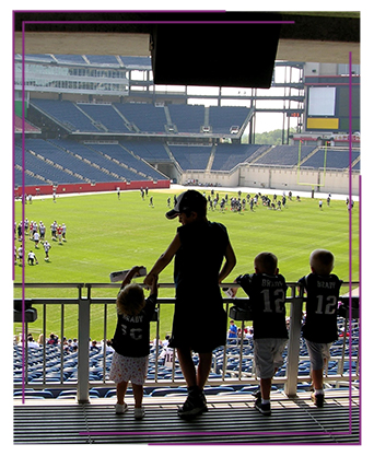 A mom out with her children at a baseball game